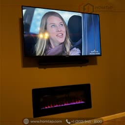 Modern Wall-Mounted TV and Electric Fireplace Installation thumbnail 2